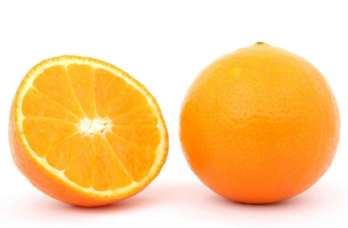 Orange cut in half on a white background